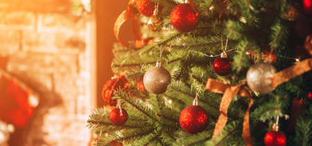 A beautiful and decorated Christmas tree and a large fireplace. Christmas mood. Great photo for store advertisingの写真素材
