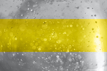 Photo of the texture sparkles bokeh in gray and yellow illuminating colors. Color year 2021.の写真素材
