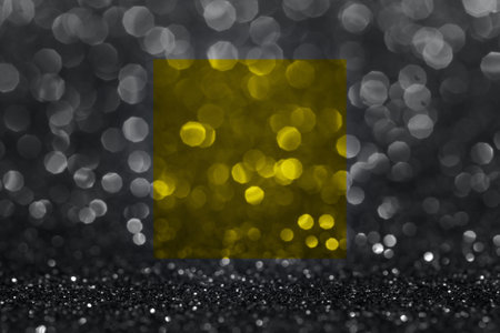 Photo of the texture sparkles bokeh in gray and yellow illuminating colors. Color year 2021.の写真素材