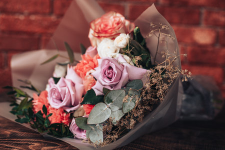 Big mix bouquet of different flowers on wooden backgroundの写真素材
