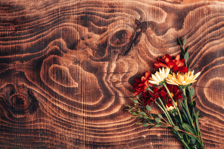Beautiful bouquet of mix flowers on wooden background. A gift for any occasion or wedding. Flower shop advertising banner.の写真素材