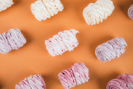 Background from multi-colored marshmallows located in a row. Tea drinking concept. Confectionery decoration. Place for text.の写真素材