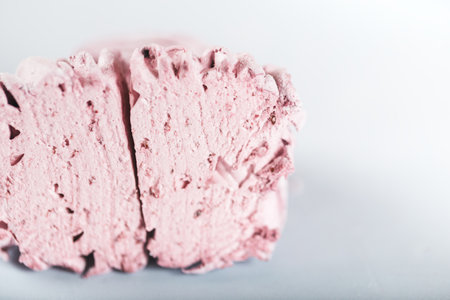 Appetizing pink zephyr in a cut against a white background. Tea drinking concept. Confectionery decoration. Place for text.の写真素材