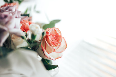 A large beautiful bouquet of mix flowers on a light background. A gift for any occasion or wedding. Flower shop advertising banner.の写真素材