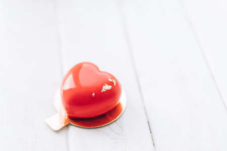 Red heart-shaped cake. Gift for Valentine's Day and Women's Day.の写真素材
