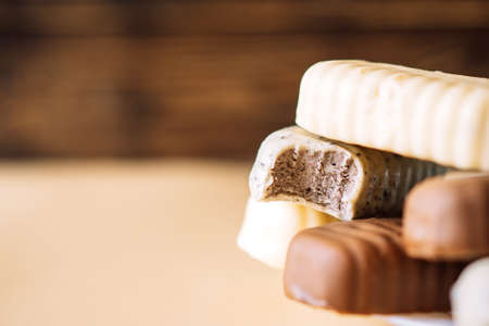 Still life of chocolate  lying on a plate on a wooden background table. Copy space.の写真素材