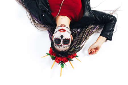 Close up Portrait of creepy beautiful l woman lying on white background, flat lay. Professional...