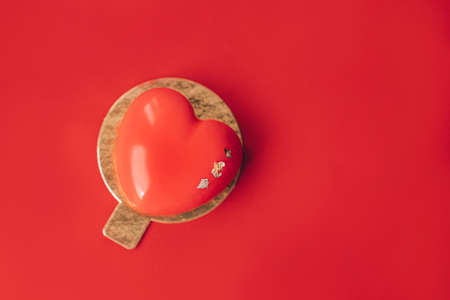 Red heart-shaped cake. Gift for Valentine's Day and Women's Day.の写真素材