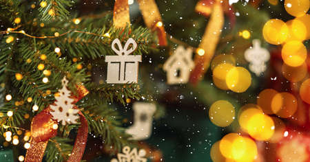 Decorated Christmas tree close up with wooden toys and garland.の写真素材