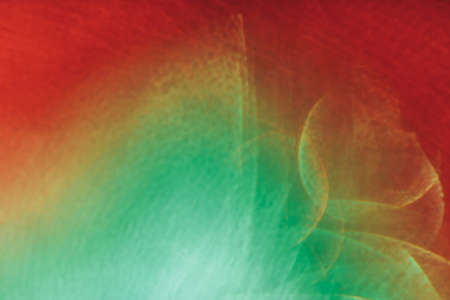 Close-up water against red and green, blurred photo