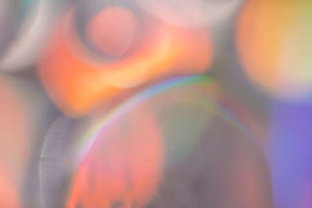 Blurred background of bubbles in water under multicolored lightingの写真素材
