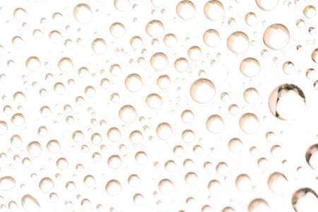 Background of water drops on the glass surface of compact discの写真素材