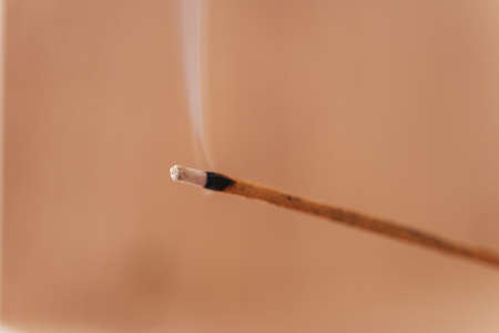 Smoldering incense close up against backgroundの写真素材