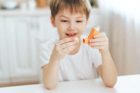 Little boy playing with an inhalerの写真素材