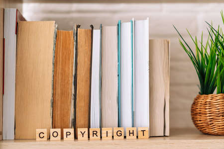 Word copyright made of letters in front of booksの写真素材