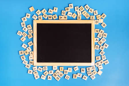 Chalk board with latin letters on blue backgroundの写真素材