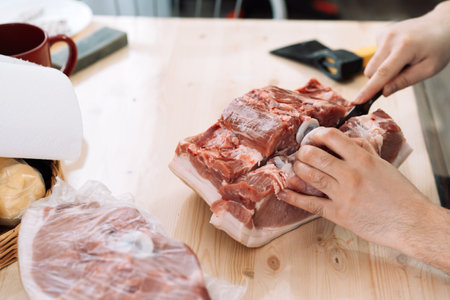 Cutting into pieces of pork chopの写真素材