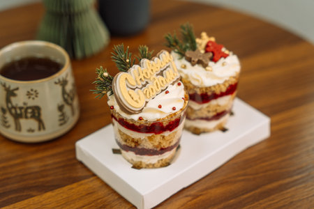 Christmas trifle in a glass glass with fruit fillingの写真素材