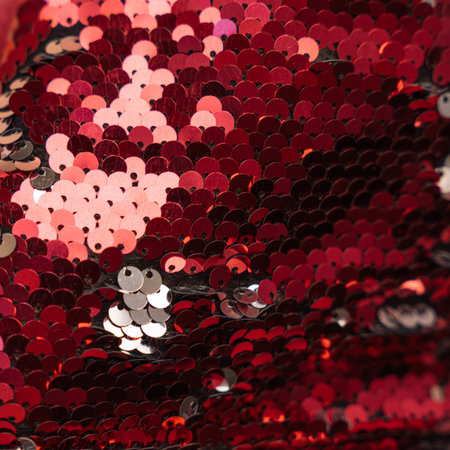 Red shiny sequin background close upの写真素材