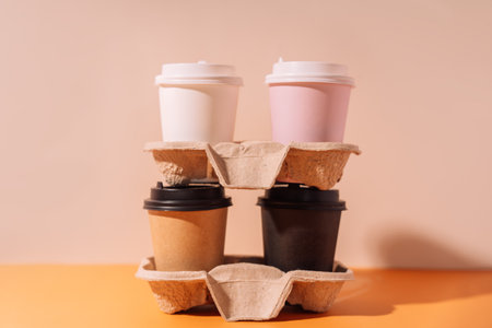 Paper cups in a tray stand on top of each otherの写真素材