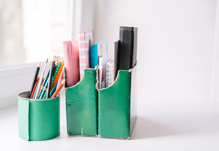Recycling cans and cardboard boxes for stationery