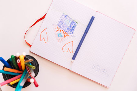 Childrens drawing in a notebook drawn with a felt-tip penの写真素材