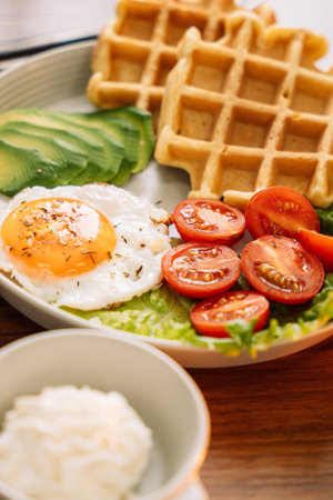 Egg with waffles for breakfast.の写真素材