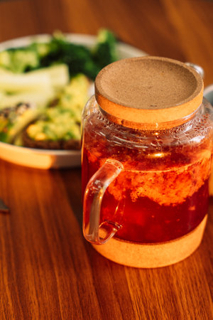 Healthy breakfast egg avocado greens and salad and raspberry tea.の写真素材