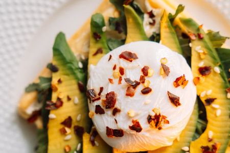 waffles with poached egg avocado on plate on wooden background.の写真素材