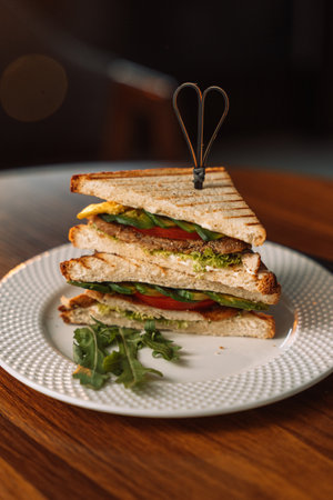 Grilled Meat and Tomato Triangle Sandwiches.の写真素材