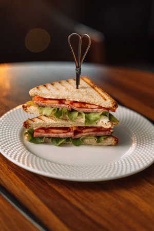 Grilled Ham and Tomato Triangle Sandwiches.の写真素材