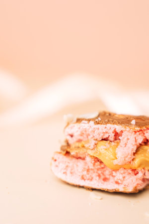 Colorful French desserts. Cake macaroons Juicy macaroon filling.