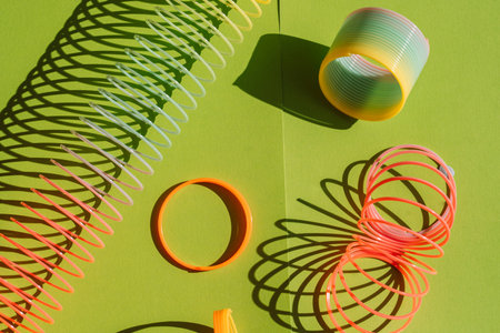 Retro slinky toys on green backgroundの写真素材