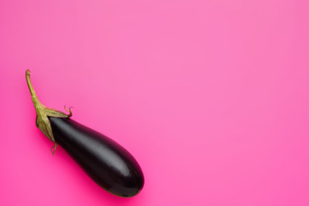 Eggplant on pink background, minimal healthy food conceptの写真素材
