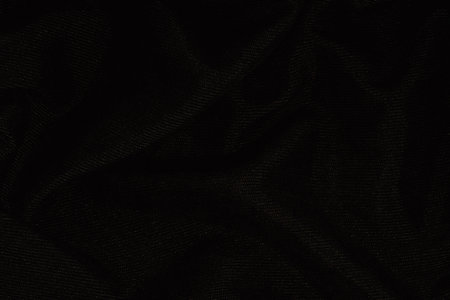 Black fabric texture background with folds and copy spaceの写真素材