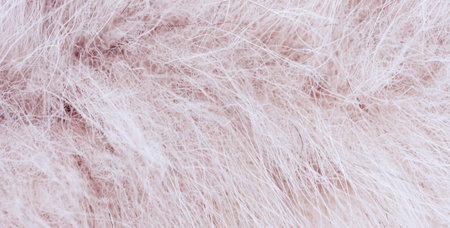 Soft pastel pink fluffy faux fur texture backgroundの写真素材