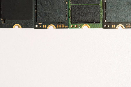 M.2 NVMe SSD modules top border on white background with copy space