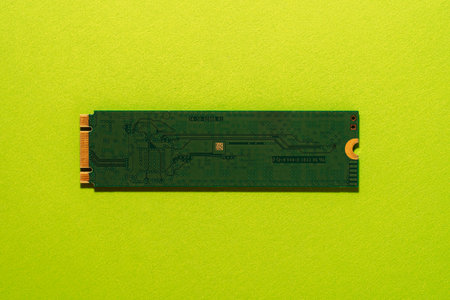 M.2 SSD back side centered on green background, minimal technology concept