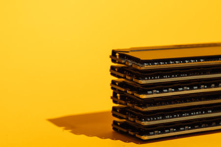 RAM modules stacked with strong shadow on yellow backgroundの写真素材