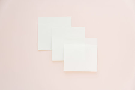 Three blank sticky notes on pastel pink background, minimal mockup