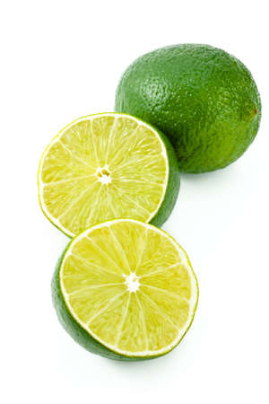Juicy green lime isolated on white background の写真素材