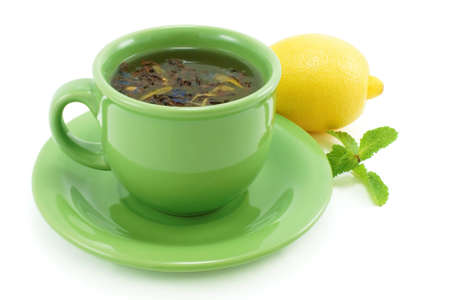Cup with green tea, with mint and lemon の写真素材