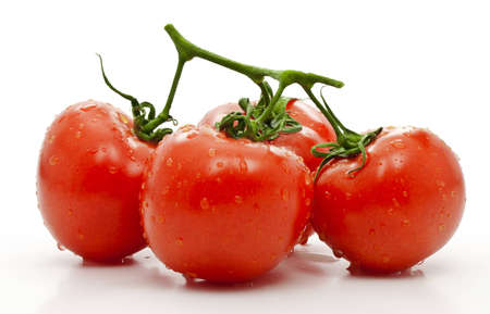 Red tomato with green leaf isolated on white の写真素材