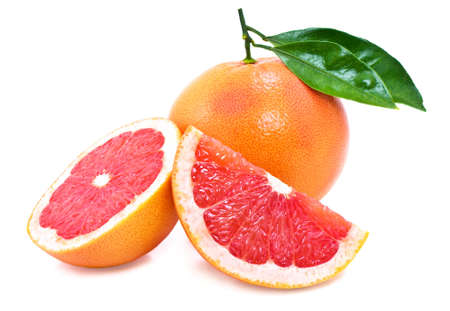 Juicy, ripe grapefruit with green leaves の写真素材