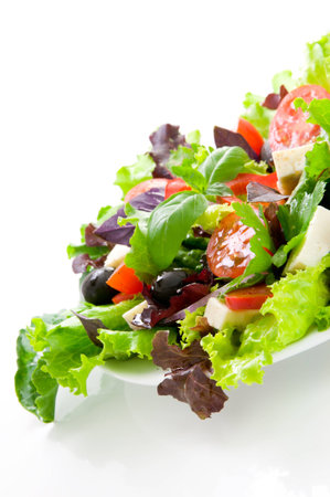 Vegetable salad with cheese and black olivesの写真素材