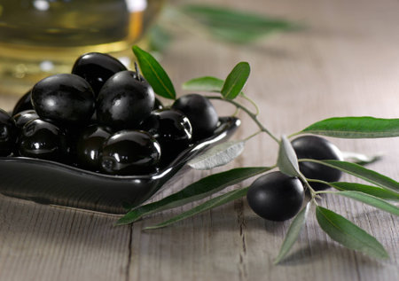 Olives on wood background の写真素材