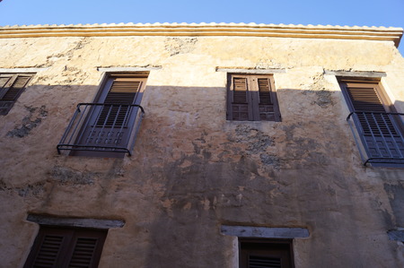 vintage looking windows at an old buildingの写真素材