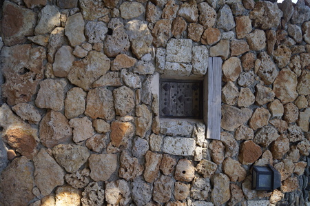 Wood and Iron window at an old stone buildingの写真素材