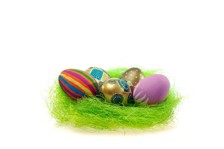 Colorful easter eggs in the brown basket