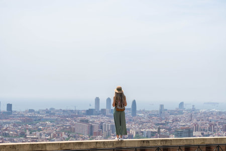 happy blonde woman enjoying the view at the top of the cityの写真素材